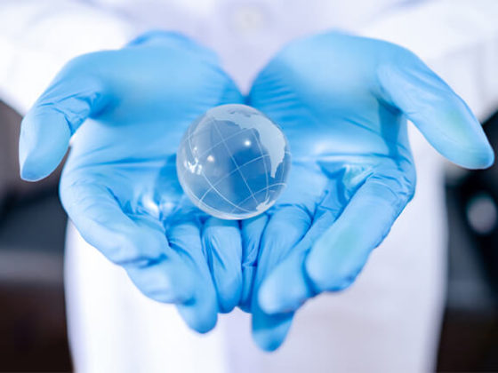 Doctor hand holding world crystal ball