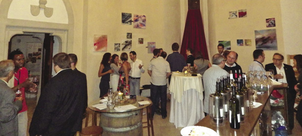 Attendees enjoy the Slovak winetasting social event.