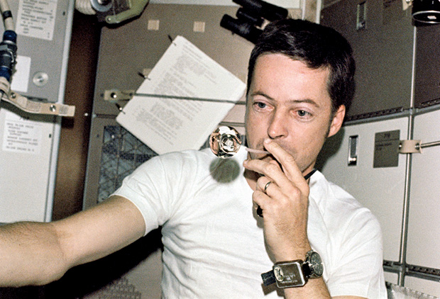 In orbit aboard Skylab in 1973, science pilot Joe Kerwin, M.D., blows water through a straw in zero gravity and creates perfectly spherical droplets. Kerwin not only was part of the initial manned crew to Skylab, the first U.S. space station, but he was also involved in the station’s design and development. (Photo courtesy of NASA .)