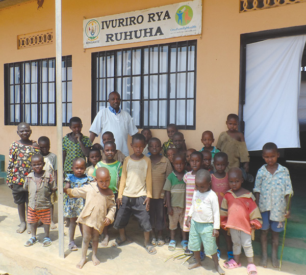 Franchisee Joseph Rurangirwa, who works in the Ruhuha village of the Gatsibo District, has been been part of the OFH network for over 12 months. He sees over 1,000 patients a month during his busiest months and is shown here with some of the children of Ruhuha. (Photo courtesy of Priscila Hancock, OFH.)