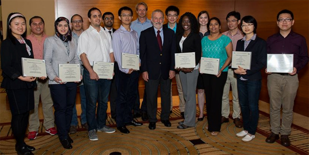 Finalists of the IEEE EMBS Student Paper Contest receiving their award certificates from EMBS President Bruce Wheeler.