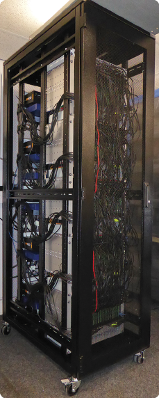 The SpiNNaker computing resource—a rack with three card frames, 100,000 ARM cores—which is roughly equivalent to the scale of a mouse brain. (Photo courtesy of Steve Furber/University of Manchester.)