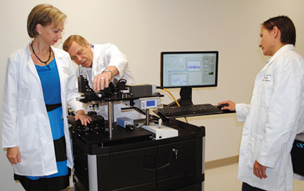 Zharov and the members of his research group work on a universal photoacoustic diagnostic platform for the early detection of rare circulating tumor cells, in particular, for use in melanoma patients. (Photo courtesy of UAMS.)