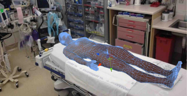 FIGURE 1 - A mockup showing how Sim X’s holographic patient could be used in a simulation, with actual medical equipment. (Photo courtesy of SimX.)