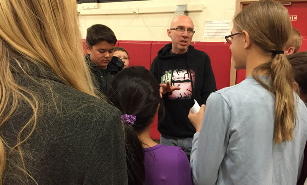 Dr. Chris Forsythe (center) gathers with students from the Brain Hackers club after the performance.