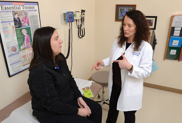 Figure 1: As director of research and education at the Parkinson’s Disease and Movement Disorder Center at the University of Kansas Medical Center, Dr. Kelly Lyons (right) works with essential-tremor patients during clinical trials and also helps to develop patient educational materials and symposia. (Photo courtesy of the University of Kansas Medical Center.)