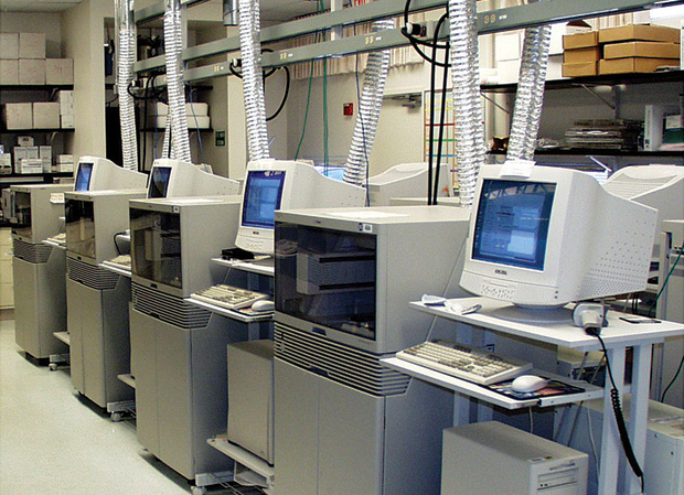 Figure 1: This 2001 photo of DNA sequencing equipment at the NIH’s Intramural Research Center, Advanced Technology Center, in Gaithersburg, Maryland, suggests the “hundreds, hundreds, hundreds” of machines required at the time. (Photo courtesy of Eric Green, NHGRI, NIH.)