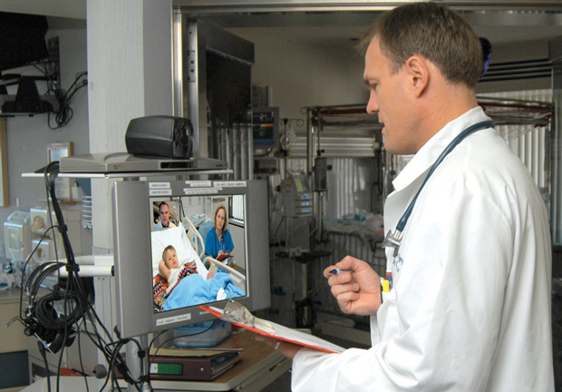 Figure 1: James Marcin, M.D., provides a telemedicine consultation from the Pediatric ICU at UC Davis, where he is the director of the Children’s Hospital Pediatric Telemedicine Program. (Image courtesy of UC Davis; photo courtesy of Daniel Kurywchak.)