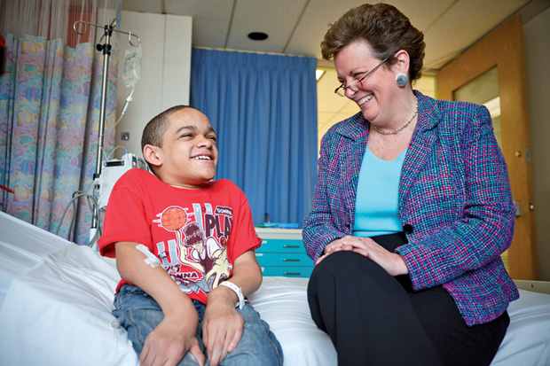 Figure 1: Rare diseases affect approximately 350 million people worldwide, more than the entire population of the United States. Here, Lisa Guay-Woodford, M.D., principal investigator at the Clinical and Translational Science Institute at Children’s National, talks with patient Michael Lewis during a 2012 visit. Lewis has the rare disease known as Morquio A syndrome (mucopolysaccharidosis IVA), which has no cure. (Photo courtesy of the National Center for Advancing Translational Sciences.)
