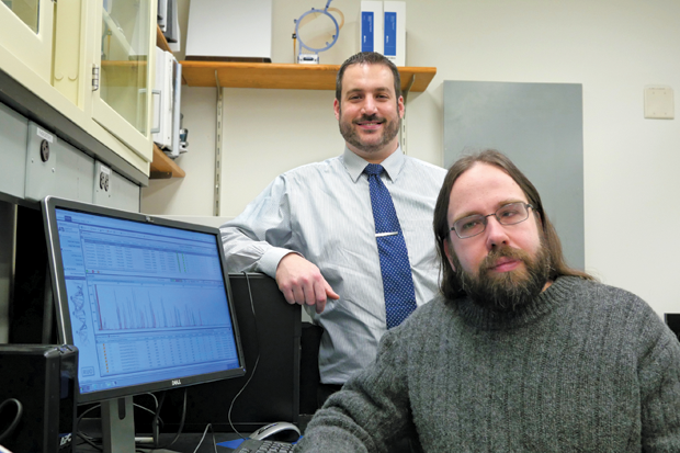 Figure 2: Michael Marciano (left) and Jonathan Adelman of Syracuse University developed a technology to solve a major issue in the forensics field: quickly and accurately determining the number of contributors in a DNA sample. (Photo courtesy of Amy Manley, communications manager, College of Arts and Sciences, Syracuse University.)
