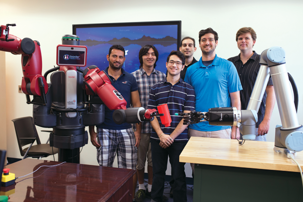Figure 6: The Florida Atlantic University team, led by Erik Engeberg (far right), demonstrating its soft robotic creations. (Photo courtesy of Erik Engeberg.)
