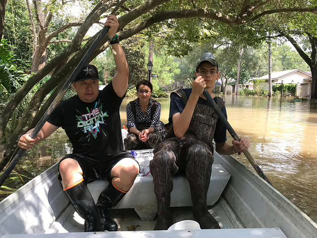 Figure 2: Graduate students from Rice University accessing a flooded home by boat to collect water samples from inside a house after Hurricane Harvey hit in Houston, Texas. (Photo courtesy of Qilin Li.)