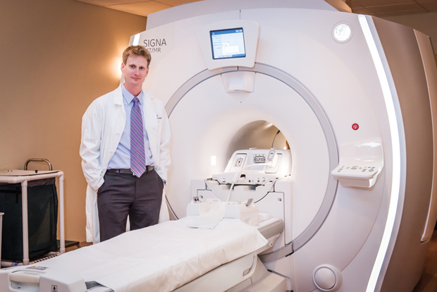 Figure 5: Thomas Hope, M.D., assistant professor of abdominal imaging and nuclear medicine at UCSF, has been evaluating gallium compounds for use in treating both neuroendocrine tumors and prostate cancer. He is shown here with PET/MRI hybrid imaging technology. (Photo courtesy of UCSF.)